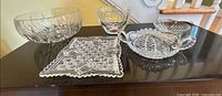 Group shot showing all five pressed glass pieces on tabletop