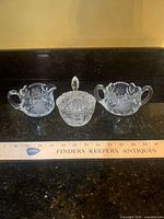 All three cut glass pieces side by side on countertop