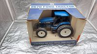 Front view of boxed Ford 8670 tractor model
