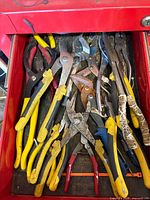 Drawer containing assorted pliers and cutters
