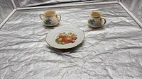 Full view of plate, creamer, and sugar bowl on display