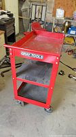 Full view of Gray Tools red 3-tier rolling cart, front angle