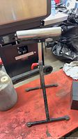 Full view of Jobmate roller stand showing frame, roller, base