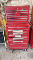 Full view of stacked Mastercraft red steel tool chest on casters