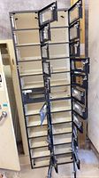 Full view of metal cubby locker showing stacked locking compartments