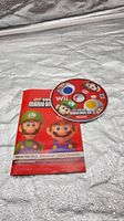Front view of manual and labeled game disc