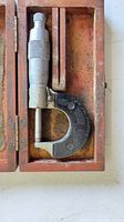 micrometer inside wooden case showing overall layout