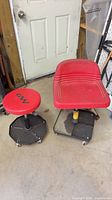 Both rolling shop stools side by side showing overall design and condition