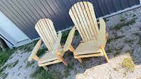 Both wooden Adirondack chairs front view