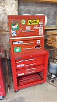 Full view of stacked red tool chest system with stickers
