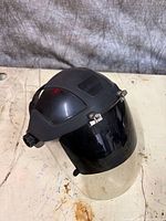 Front view of Sellstrom face shield showing tinted visor and headgear