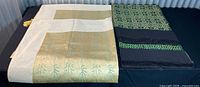 Both folded panels side by side showing colors and embroidery