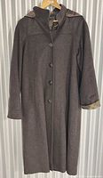 Full view front of brown long overcoat on hanger
