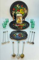 Group view showing trays, tankard, stopper, glasses and all spoons