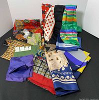 Group shot of all colourful scarves spread out