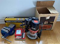 Router, bench vise, tile cutter box, bit set case and router box