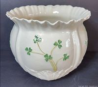 Front view showing flared scalloped rim, shamrock decoration