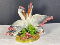 Front view of porcelain herons figurine