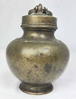 Full view of brass vessel with lid attached