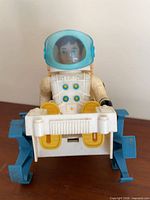 Front view Billy Blastoff seated in vehicle