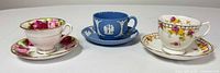 All three teacup and saucer sets side by side