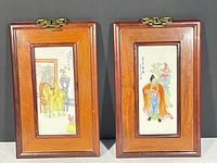 Both framed porcelain plaques front view