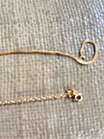 Close-up of snake chain end with clasp