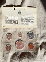 Front view of sealed 1967 Centennial mint set with backing card and all six coins visible