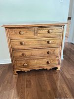 Front view of 5-drawer solid wood dresser