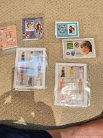 Overview of all five Princess Diana souvenir stamp sheets in protective sleeves