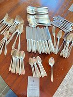 Full view of all flatware pieces laid out on tabletop