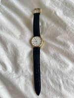 Front view of entire watch showing dial, strap, and buckle