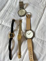 All four wristwatches laid out for overview