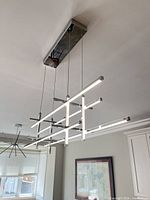 Overall view of chandelier suspended from ceiling