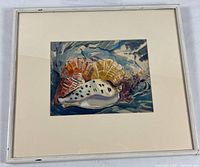 Full view of framed seashell print with mat and frame