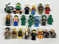 Group shot of all 20 minifigures showing front details and accessory