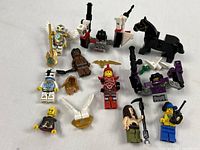 Group shot of all minifigures, horse and loose accessories