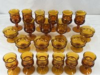 Group shot of all 21 amber King’s Crown pieces arranged in rows