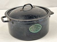Side view showing pot, handles, label