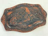 Full view of Kamakura-bori platter showing overall shape, carving, and finish