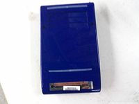 Underside of blue hard drive enclosure showing vents and barcode