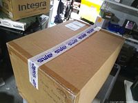 Sealed outer cardboard shipping box on cart