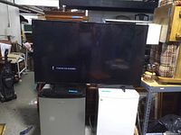 Front view of Philips 55'' TV powered on displaying 'Channel not available' message