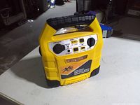 Front view showing control panel, label and overall condition of jump starter