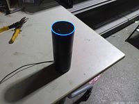 Amazon Echo powered on showing blue LED ring