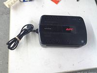 Top view showing APC Back-UPS 600 with power cord and outlets