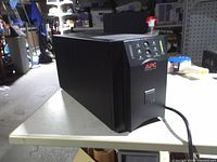 Full left-front view of APC Smart-UPS 1500 on table