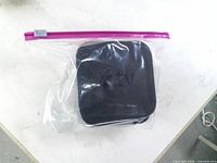 Apple TV unit in plastic bag top view