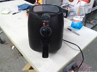 Front view of Bella air fryer showing control dials and basket handle