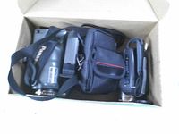 Box containing three cameras and small pouch